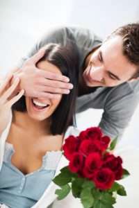 Boyfriend giving his girlfriend a bouquet of roses. [url=http://www.istockphoto.com/search/lightbox/9786786][img]http://dl.dropbox.com/u/40117171/couples.jpg[/img][/url]